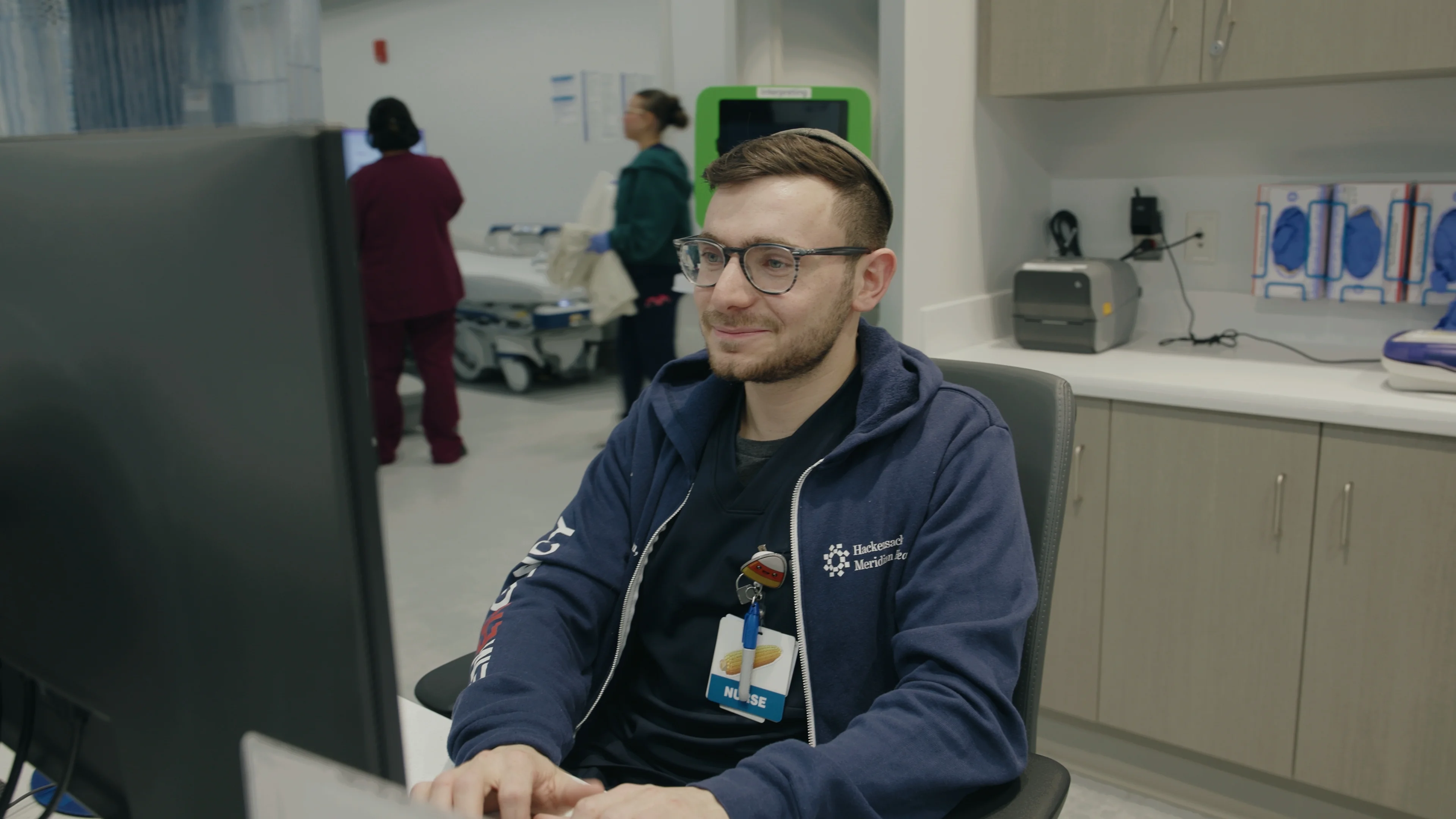 Shalom Korn, now an emergency room nurse at Palisades Medical Center, checks a patient’s records during a recent shift.
